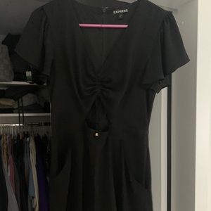 Black romper. Middle cut out.